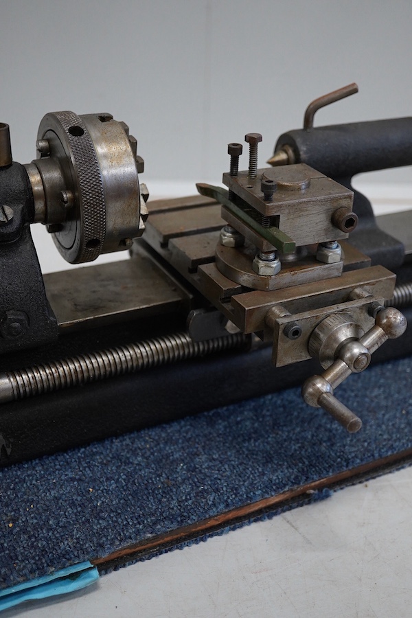 A model engineering workshop lathe, by E.W. Stringer, length 60cm. Condition - fair, some surface rust.